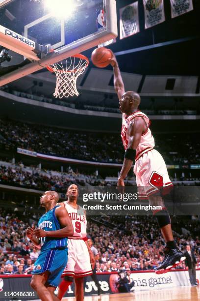 Michael Jordan of the Chicago Bulls dunks the ball against the Charlotte Hornets on May 3, 1998 at the United Center in Chicago, Illinois. NOTE TO...