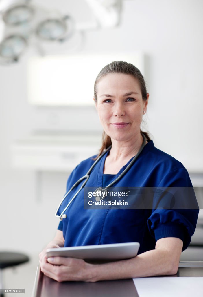 Portrait of doctor with digital tablet