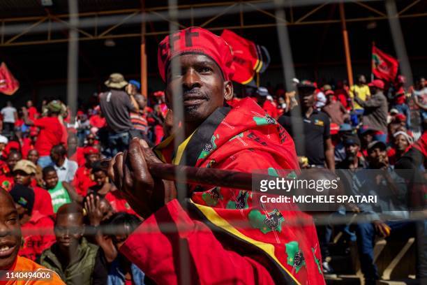 Supporter of the South African opposition party Economic Freedom Fighters dances ahead a campaign rally held at the Alexandra Stadium in...