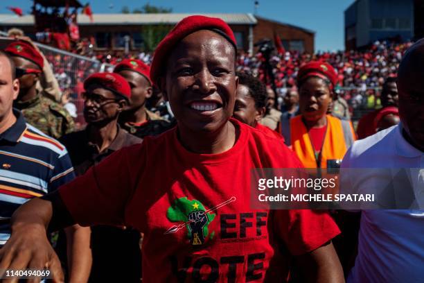 South African opposition party Economic Freedom Fighters leader Julius Malema acknowledges the crowd during a campaign rally held at the Alexandra...