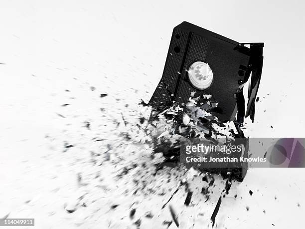 an exploding vhs tape on a white background - ruin bildbanksfoton och bilder