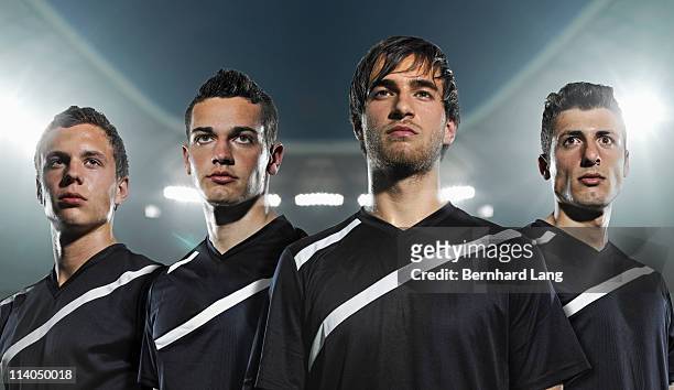 four soccer players, close up - helden stock-fotos und bilder