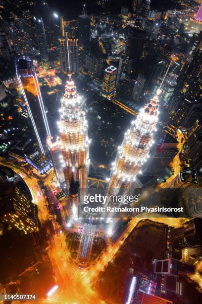 top of petronas twin towers. aerial view of kuala lumpur downtown, malaysia. financial district and business centers in smart urban city in asia. skyscraper and high-rise buildings at night - kuala lumpur twin tower stock pictures, royalty-free photos & images