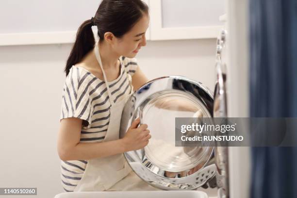 Asian Woman Washing Machine Photos and Premium High Res Pictures ...