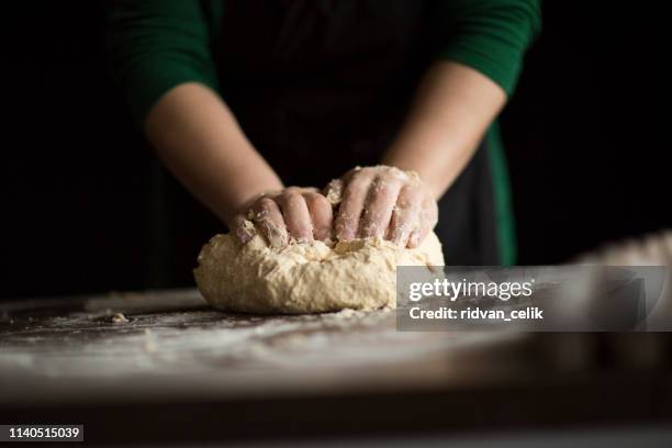 hands knead dough - kneading stock pictures, royalty-free photos & images