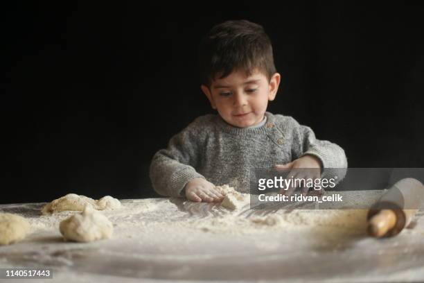 child making dough - serbia tradition stock pictures, royalty-free photos & images