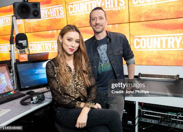 Presenters Una Healy and Baylen Leonard pose for photo to annouce the launch of new station Country Hits Radio at 1 Golden Square on April 05, 2019...