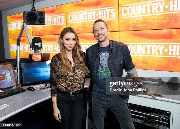 Presenters Una Healy and Baylen Leonard pose for photo to annouce the launch of new station Country Hits Radio at 1 Golden Square on April 05, 2019...