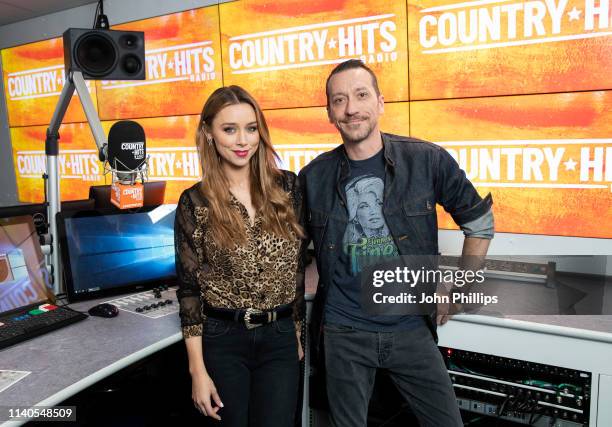 Presenters Una Healy and Baylen Leonard pose for photo to annouce the launch of new station Country Hits Radio at 1 Golden Square on April 05, 2019...