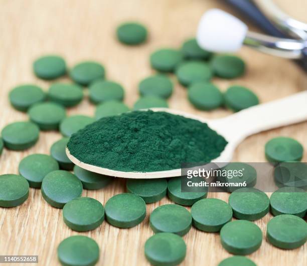 organic spirulina (blue-green algae) - stetoskop stock-fotos und bilder