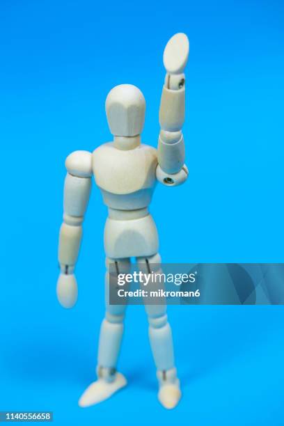 wooden mannequin gesturing hold on stop - hey - geste stop stock pictures, royalty-free photos & images