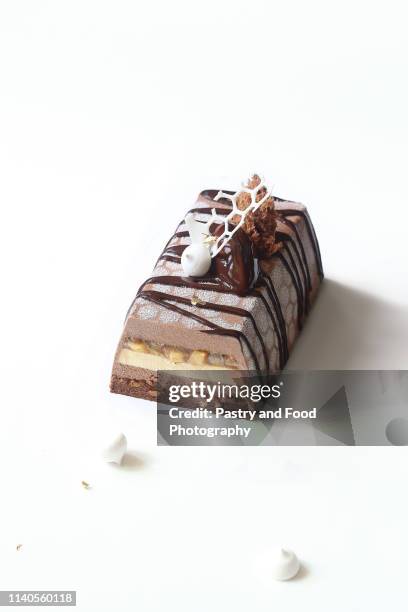 contemporary apple chocolate mousse cake - christmas log stock pictures, royalty-free photos & images