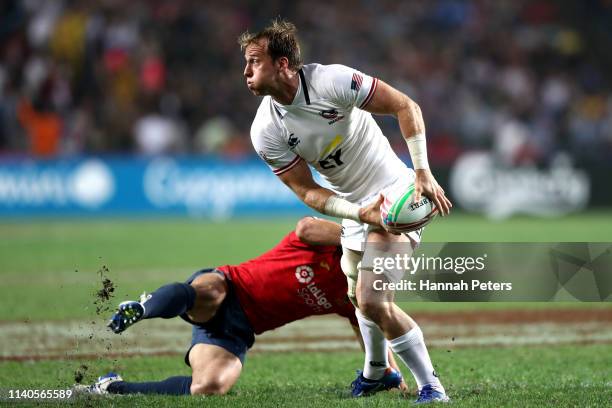 Ben Pinkelman of USA looks to pass the ball out on day one of the Cathay Pacific/HSBC Hong Kong Sevens at the Hong Kong Stadium on April 05, 2019 in...