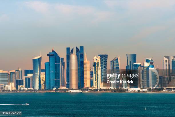 panorama of the skyline doha - capital of qatar in the morning - doha desert stock pictures, royalty-free photos & images