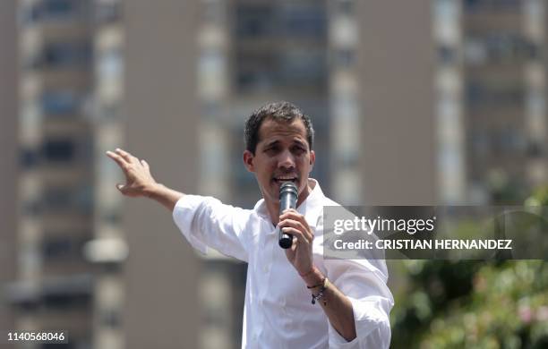 Venezuelan opposition leader Juan Guaido delivers a speech during a rally to commemorate May Day on May 1, 2019 after a day of violent clashes on the...