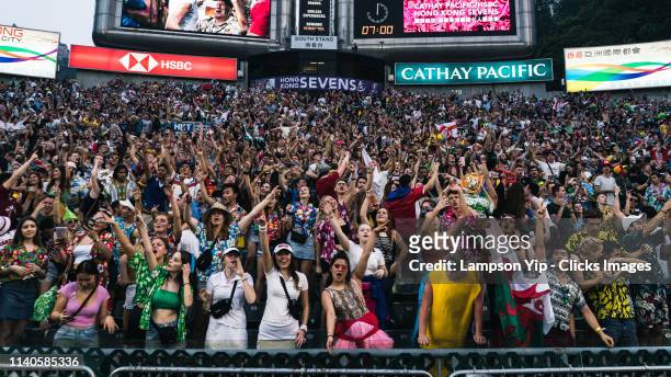 Fans from the South Stand cheering on day one of the Cathay Pacific/HSBC Hong Kong Sevens at the Hong Kong Stadium on April 05, 2019 in Hong Kong.