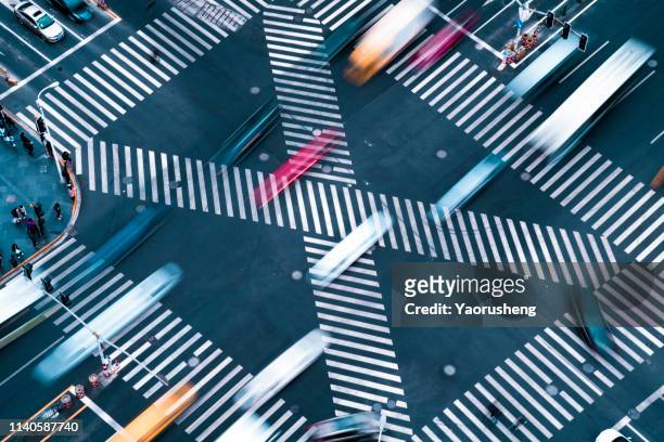 blur motioin concept.car move fast on crosswalk - road intersection stock-fotos und bilder