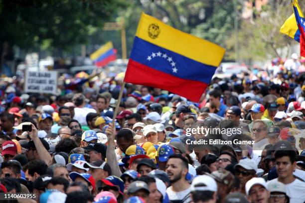 Supporters of Juan Guaido wave a flag of Venezuela during the May 1 demonstration at plaza Altamira on May 1, 2019 in Caracas, Venezuela. Yesterday,...