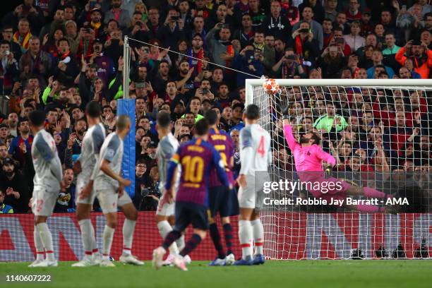 Alisson Becker of Liverpool fails to stop Lionel Messi of FC Barcelona from scoring a goal to make it 3-0 and his 600th goal for Barcelona during the...
