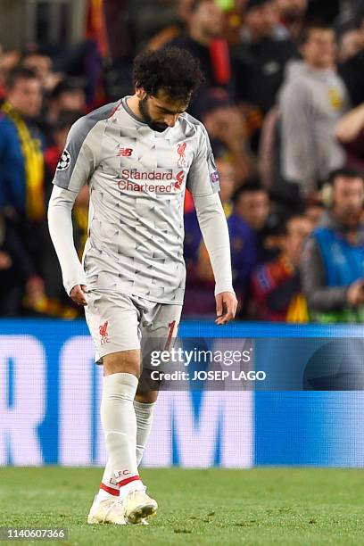 Liverpool's Egyptian forward Mohamed Salah reacts after the UEFA Champions League semi-final first leg football match between Barcelona and Liverpool...