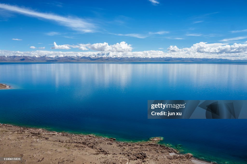 Tibetan holy symbol of the sky lake on the blue sky and white clouds