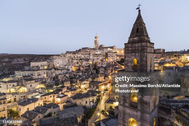 the bell tower of chiesa di san pietro barisano (originally known as st. peter de veteribus) and the sasso barisano - região da basilicata imagens e fotografias de stock