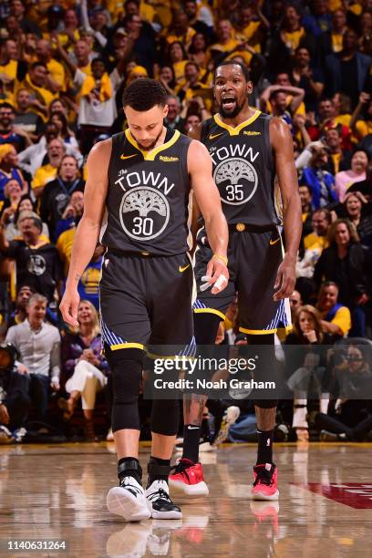 Stephen Curry and Kevin Durant of the Golden State Warriors look on during Game Two of the Western Conference Semifinals of the 2019 NBA Playoffs...