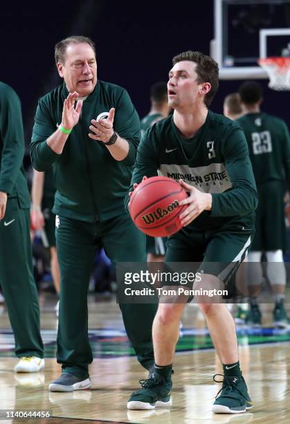 Foster Loyer of the Michigan State Spartans looks to shoot as head coach Tom Izzo looks on during practice prior to the 2019 NCAA men's Final Four at...