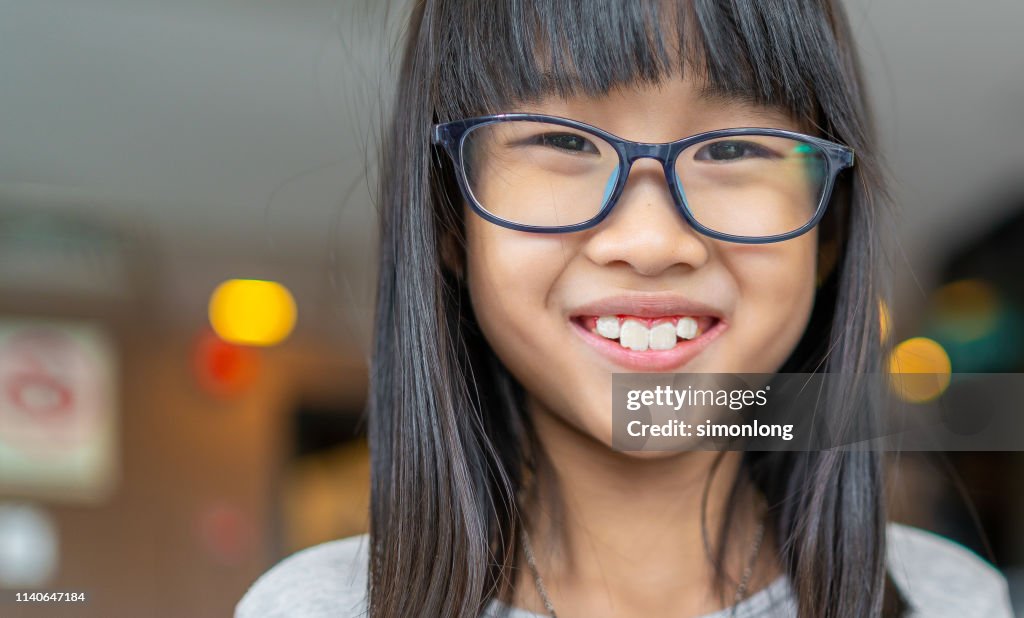 Smiling Asian girl with glasses