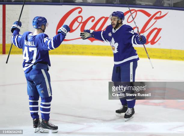 Pierre Engvall skates to Nicholas Baptiste after scoring as the Toronto Marlies beat the Cleveland Monsters 5-2 in game one in the second round of...