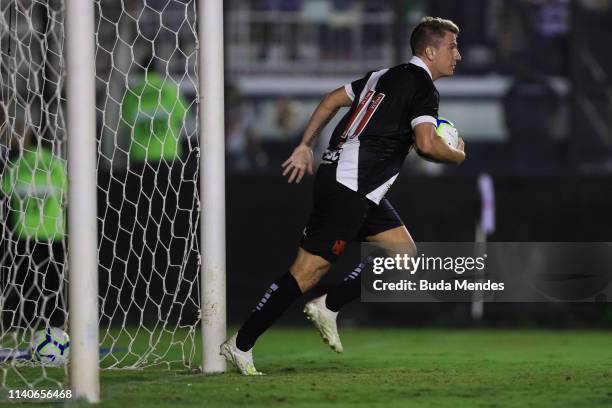 Maxi Lopez of Vasco da Gama takes the ball as he celebrates after scoring the equalizer during a match between Vasco da Gama and Atletico Mineiro as...