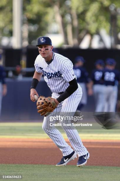 Troy Tulowitzki of the Tarpons fields a ball and makes the throw over to first base during the Florida State League game between the Charlotte Stone...