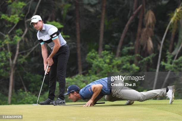 Brett Rumford of Australia and Andrea Pavan of Italy play a shot during the first round of the Volvo China Open at Genzon Golf Club on May 2, 2019 in...