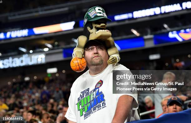 Nate Lauber, from Fond du Lac, Wis. Watches the court during Auburn's practice for the NCAA Final Four at U.S. Bank Stadium Friday, April 5, 2019....