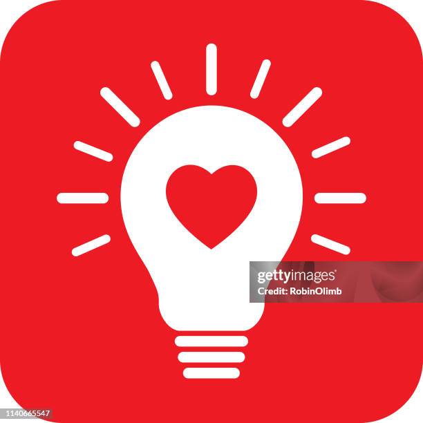 red heart light bulb icon - red light bulb stock illustrations