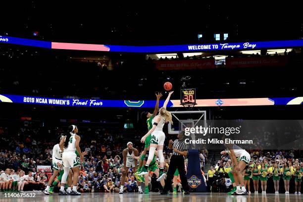 Ruthy Hebard of the Oregon Ducks and Lauren Cox of the Baylor Lady Bears battle for the opening tipoff during the first quarter in the semifinals of...