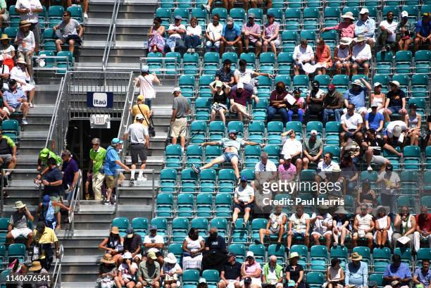 Relaxed fan of Simona Halep watches her play a match. 2019 is the first year that the Miami Open Tennis tournament was held at the Hard Rock Stadium,...