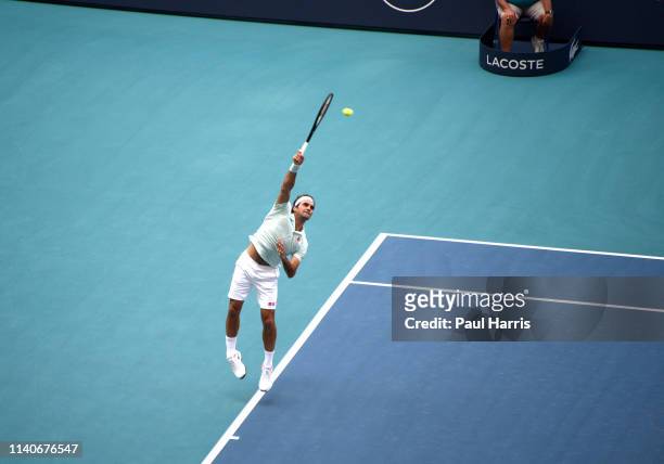 Roger Federer serves during a match. 2019 is the first year that the Miami Open Tennis tournament was held at the Hard Rock Stadium, which is also...