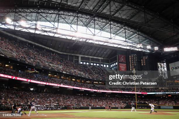 Starting pitcher Zack Godley of the Arizona Diamondbacks throws the first pitch to Andrew Benintendi of the Boston Red Sox during the first inning of...