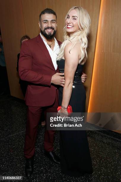 Superstars Andrade and Charlotte Flair attend the WWE Superstars For Hope Reception on April 05, 2019 in New York City.
