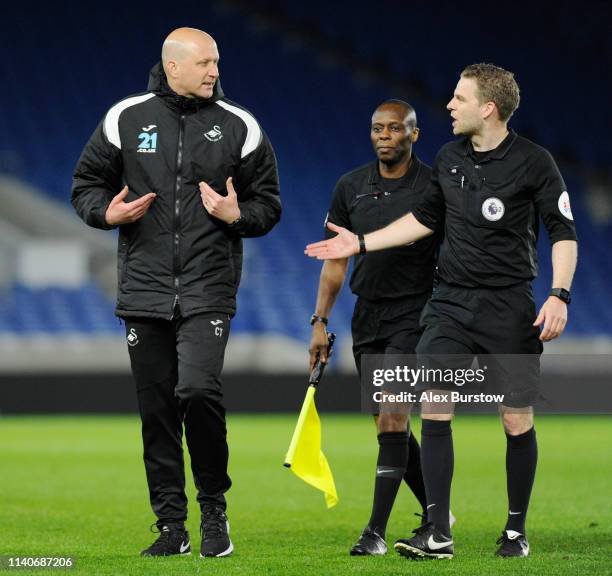 Cameron Toshack, Coach of Swansea City U23 speaks with Match Referee Christopher Pollard after the Premier League 2 match between Brighton & Hove...