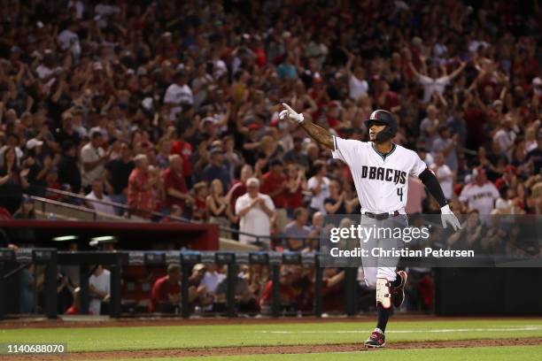 Ketel Marte of the Arizona Diamondbacks reacts after hitting a grand-slam home run against the Boston Red Sox during the sixth inning of the MLB game...