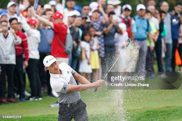 Li Haotong of China plays a shot during the day one of the 2019 Volvo China Open at Genzon Golf Club on May 2, 2019 in Shenzhen, China.