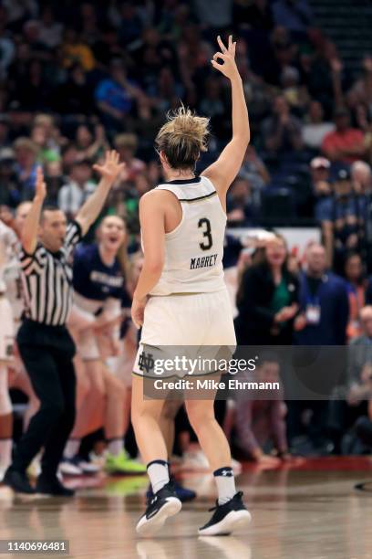 Marina Mabrey of the Notre Dame Fighting Irish celebrates a three point basket against the UConn Huskies during the fourth quarter in the semifinals...