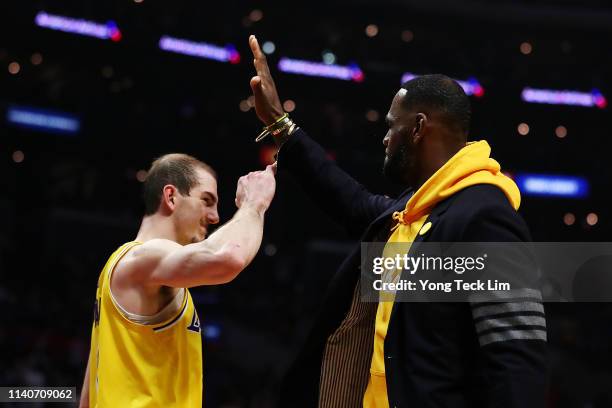 Alex Caruso and LeBron James of the Los Angeles Lakers celebrate their victory against the Los Angeles Clippers at Staples Center on April 05, 2019...