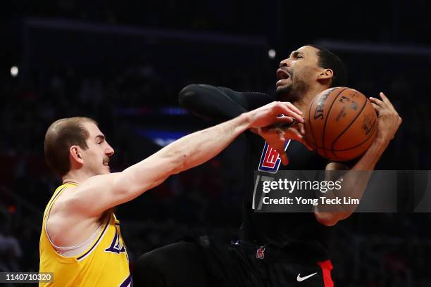 Garrett Temple of the Los Angeles Clippers is fouled on the drive by Alex Caruso of the Los Angeles Lakers during the second half at Staples Center...