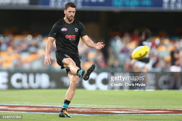 Travis Boak of the Power warms up before the round three AFL match between the Brisbane Lions and the Port Adelaide Power at The Gabba on April 06,...
