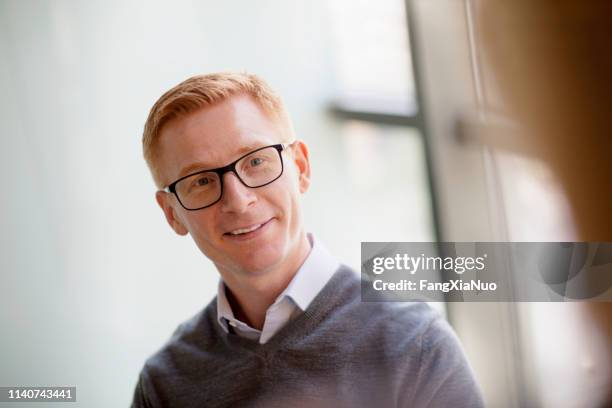 man speaking with colleague in office meeting - work respect stock pictures, royalty-free photos & images