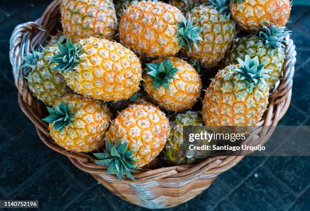 basket with pineapples - azores stock pictures, royalty-free photos & images