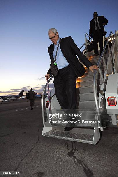 Los Angeles Lakers head coach Phil Jackson exits the plane arriving from Dallas following Game Four of the Western Conference Semifinals in the 2011...